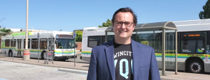 MP Kusmierczyk standing in front of Downtown Windsor's bus station.